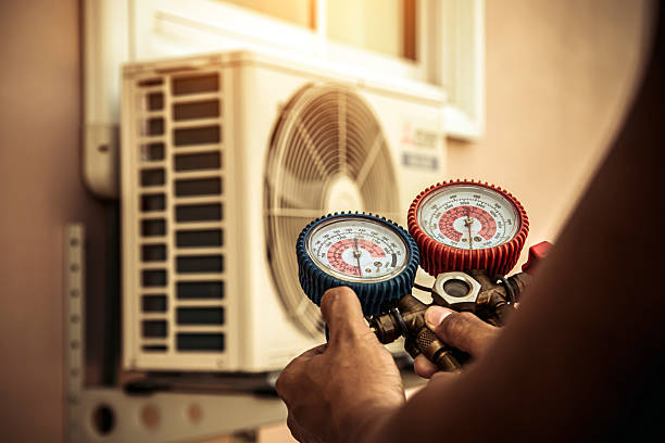 Professional Air Conditioning Service technician working in Dewey, OK